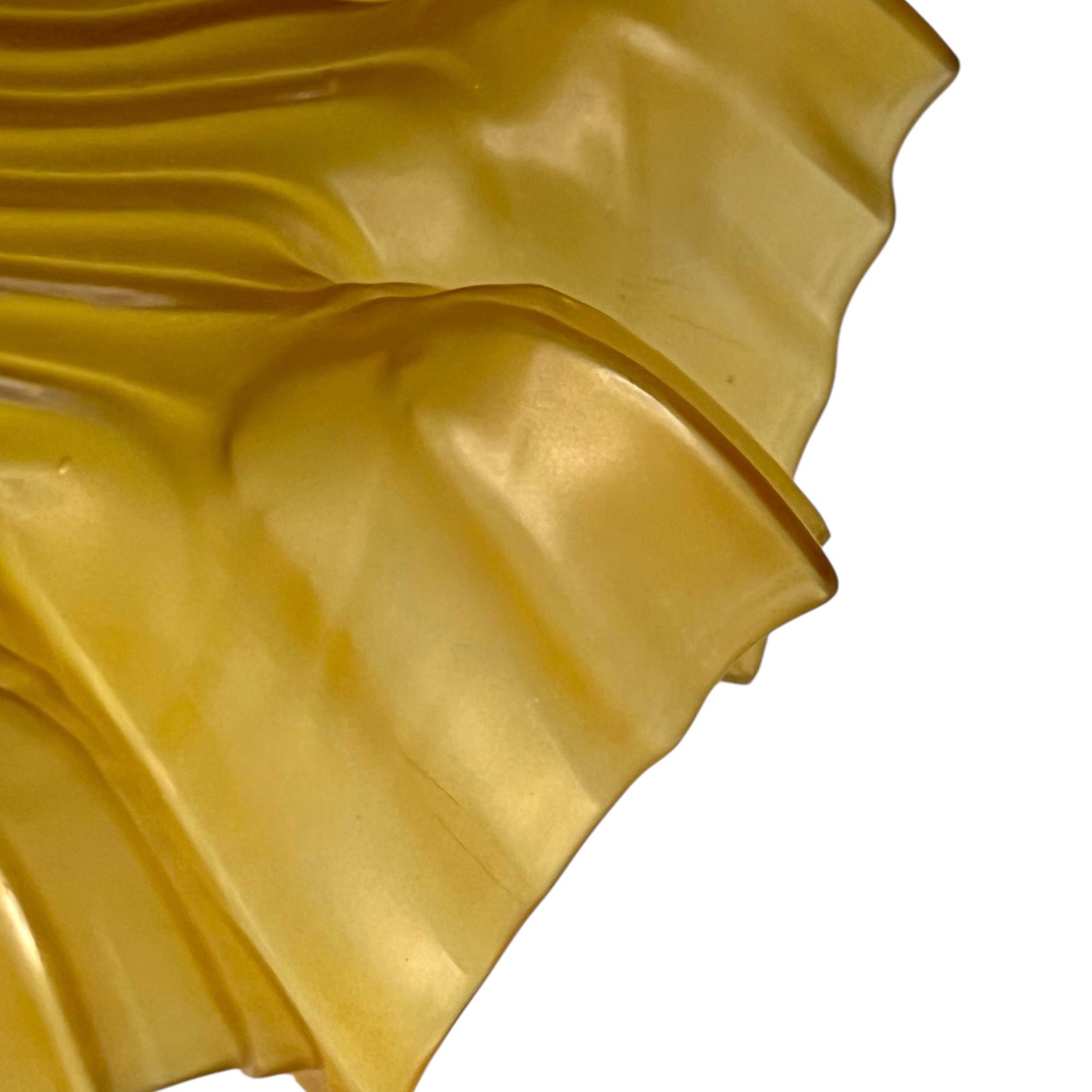 close up of amber coloured vintage French  pendant light with a scalloped design on a white background