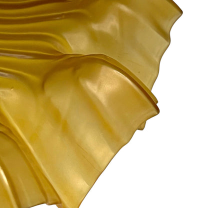 close up of amber coloured vintage French  pendant light with a scalloped design on a white background