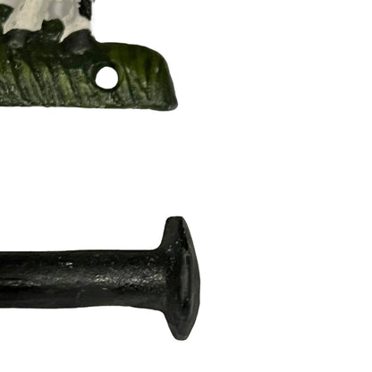 Close-up of a cow-shaped toiler paper roll holder  on a white background