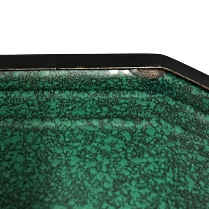 Close up of a French enamel lunch box on a white background