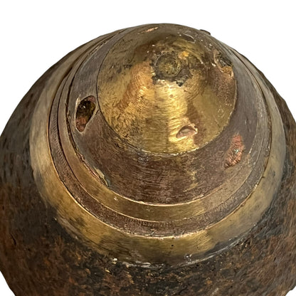 Close up of WW1 brass fuse on a white background