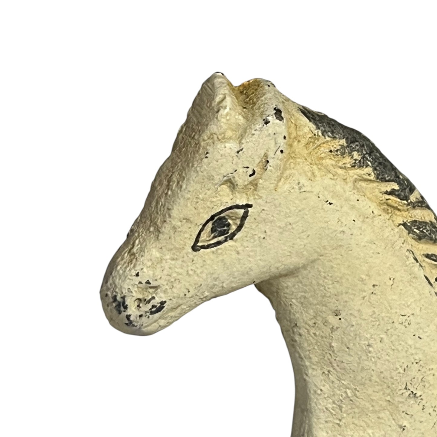Close-up of a horse head figurine in a textured cream-beige finish with black painted details around the eye and mane, isolated on a white background.