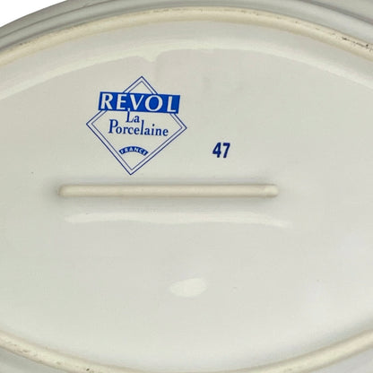 White ceramic plate with 'Revol La Porcelaine' branding and number 47 on a white background