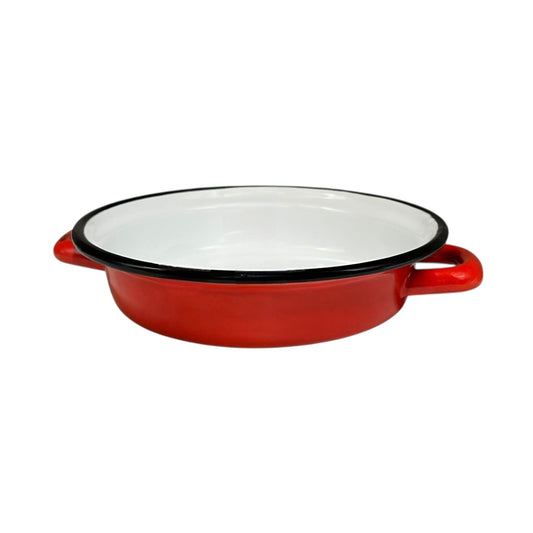 Red enamelled French vintage skillet with black rim on a white background