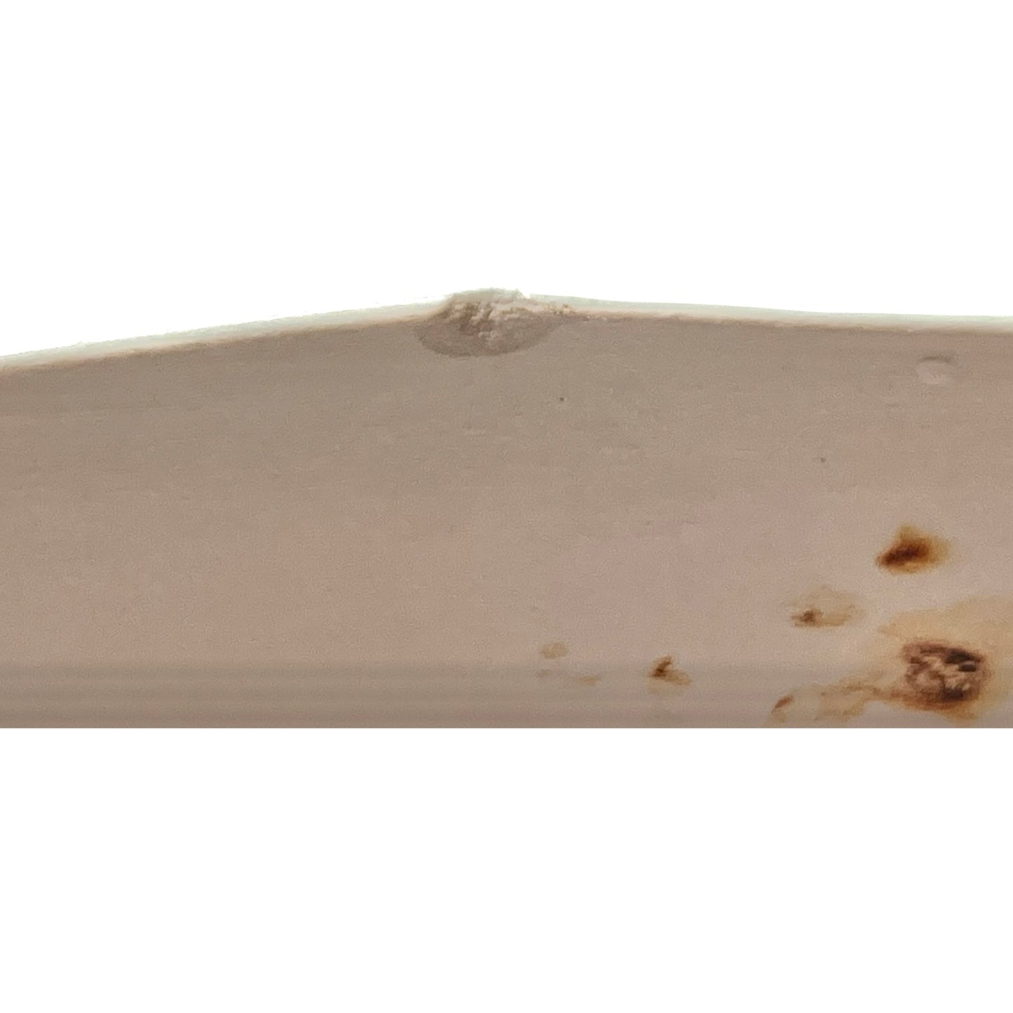 back view of pale green ceramic shelf on a white background