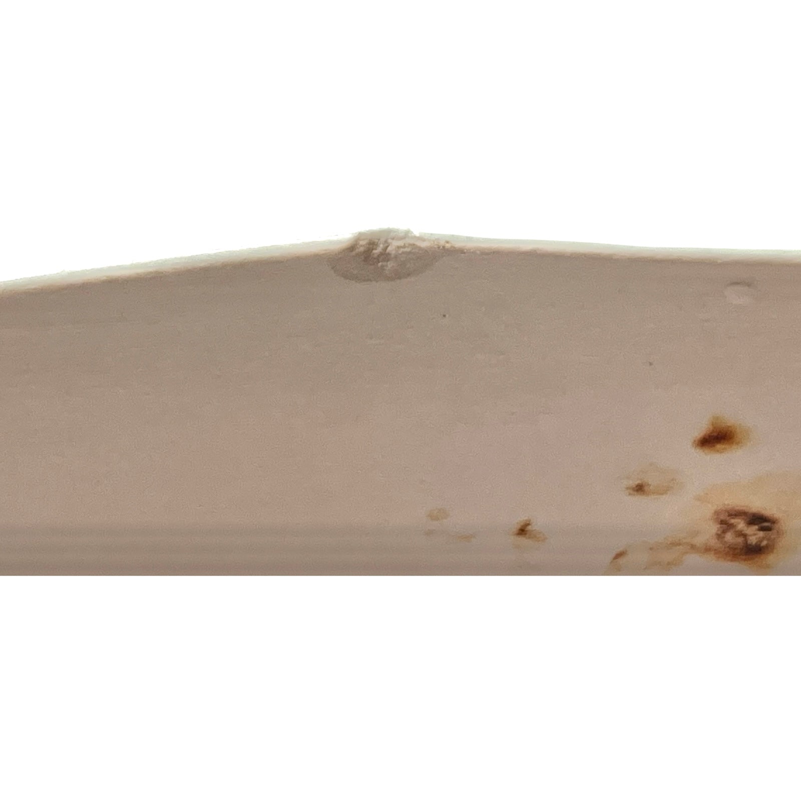 back view of pale green ceramic shelf on a white background