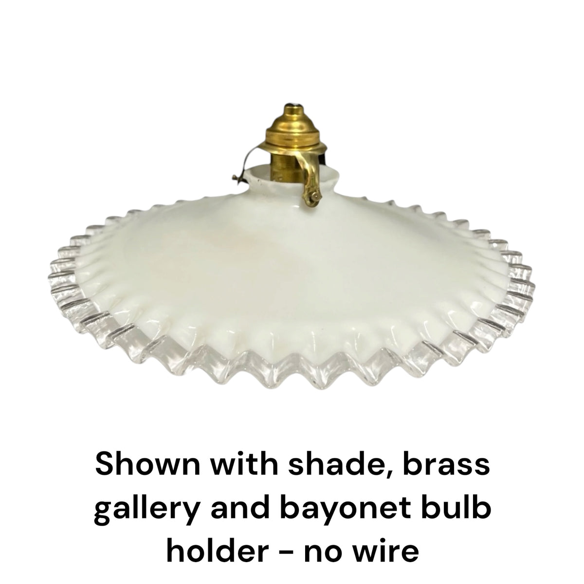 An off-white glass shade with a fluted, scalloped edge, shown with a brass gallery and bayonet bulb holder against a white background, with text below stating 'Shown with shade, brass gallery and bayonet bulb holder - no wire'.