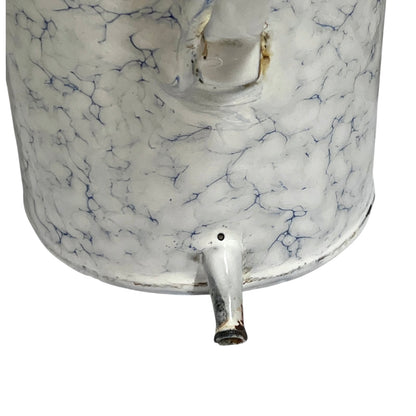 Close-up of a white enamel-covered metal container with a blue crackle marbled pattern, featuring a small spout and a handle, isolated on a white background.