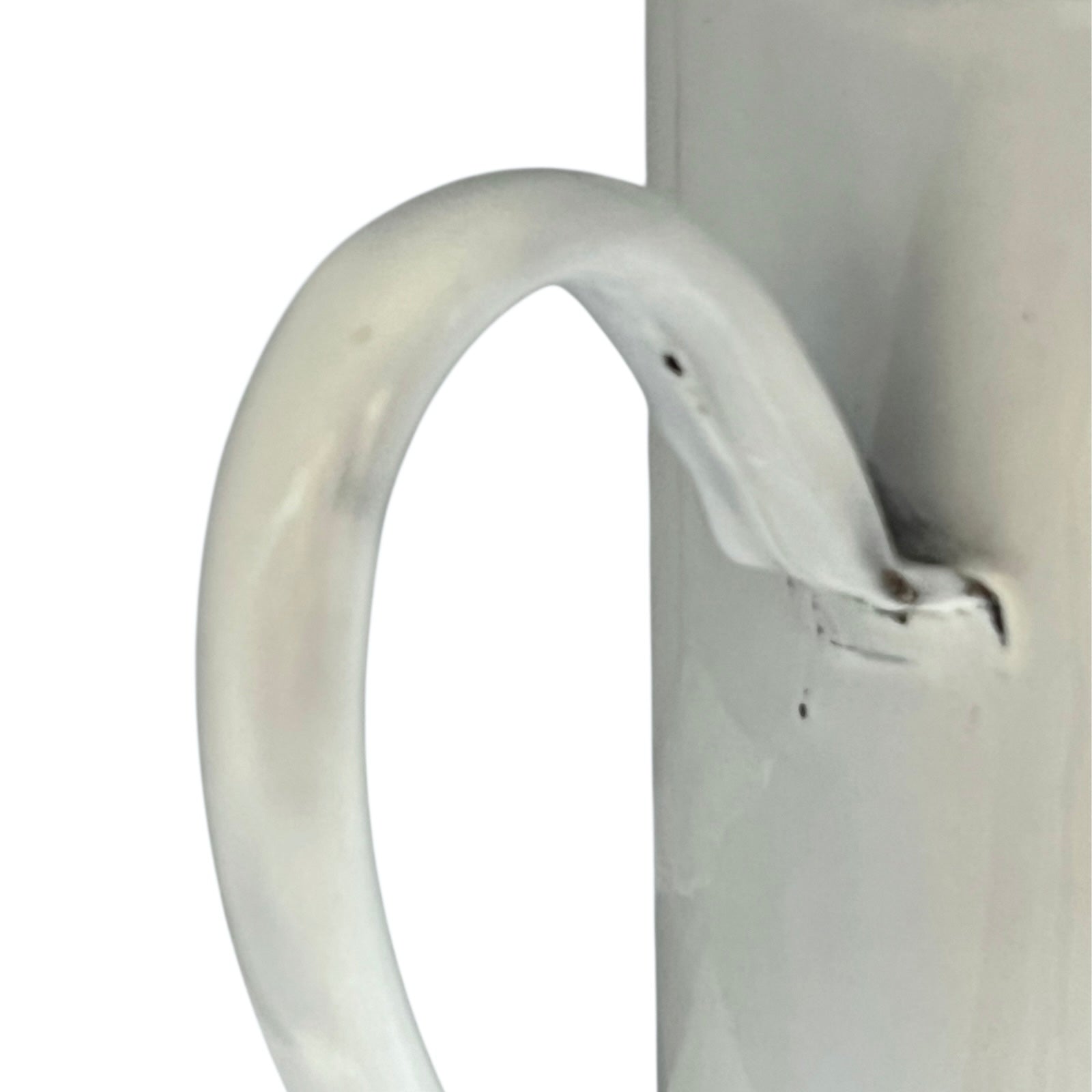 Close up of  French vintage enamel planter with a flat back and a spout on a white background
