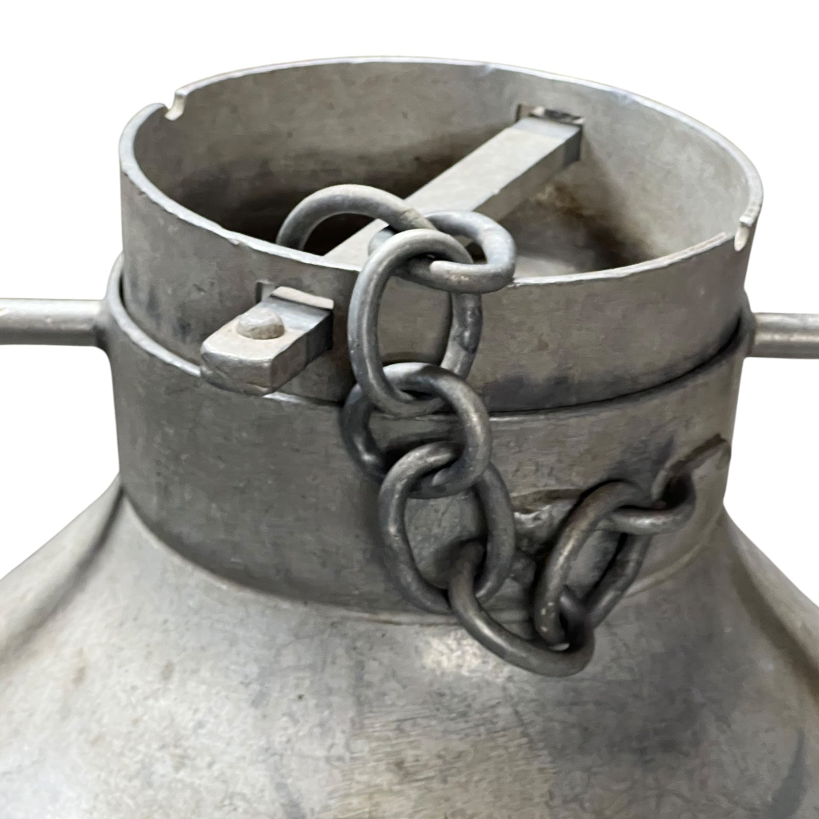 Metal container with a chain attached on a white background