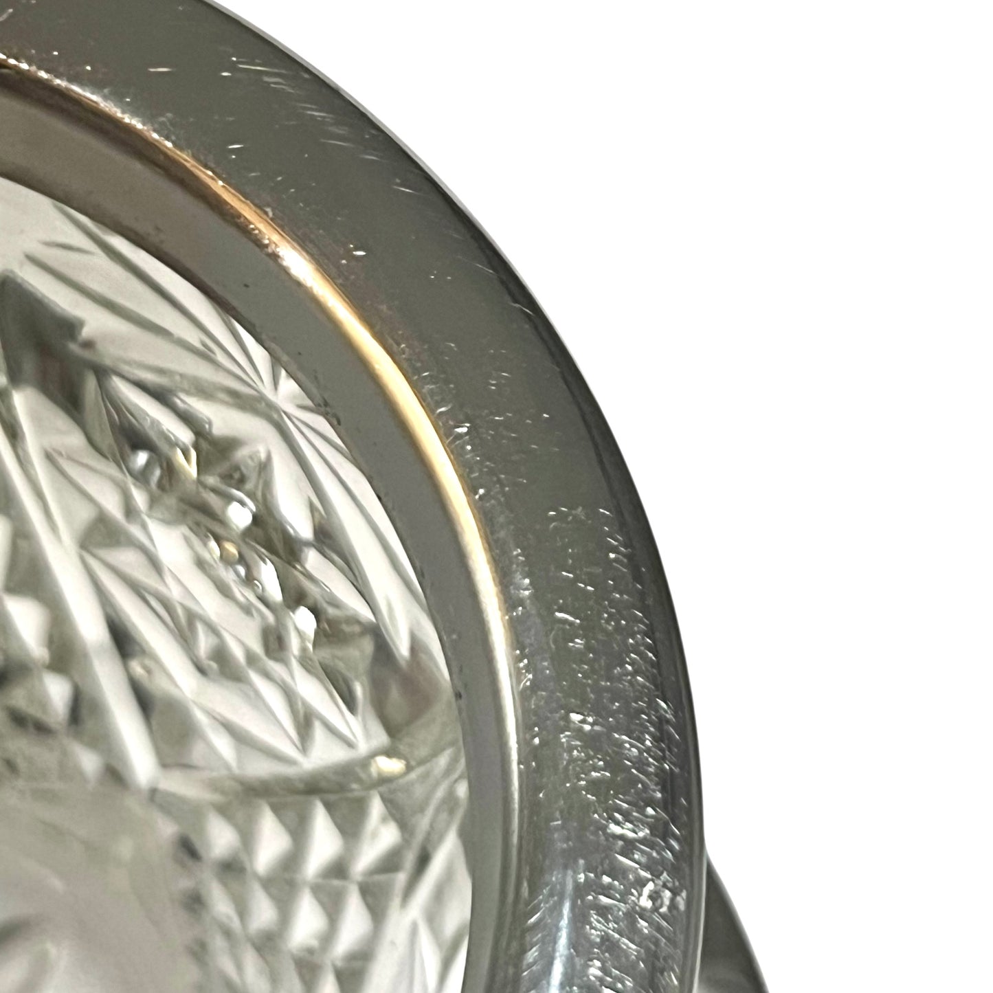 Close up of a decorative glass vintage ice bucket on a white background