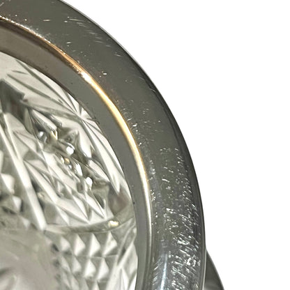 Close up of a decorative glass vintage ice bucket on a white background