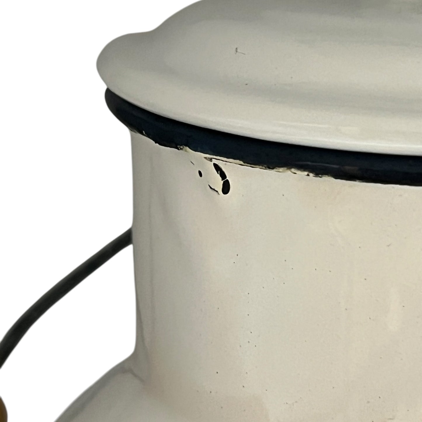 Close up of a white enamel milk churn and mug with duck design on a white background