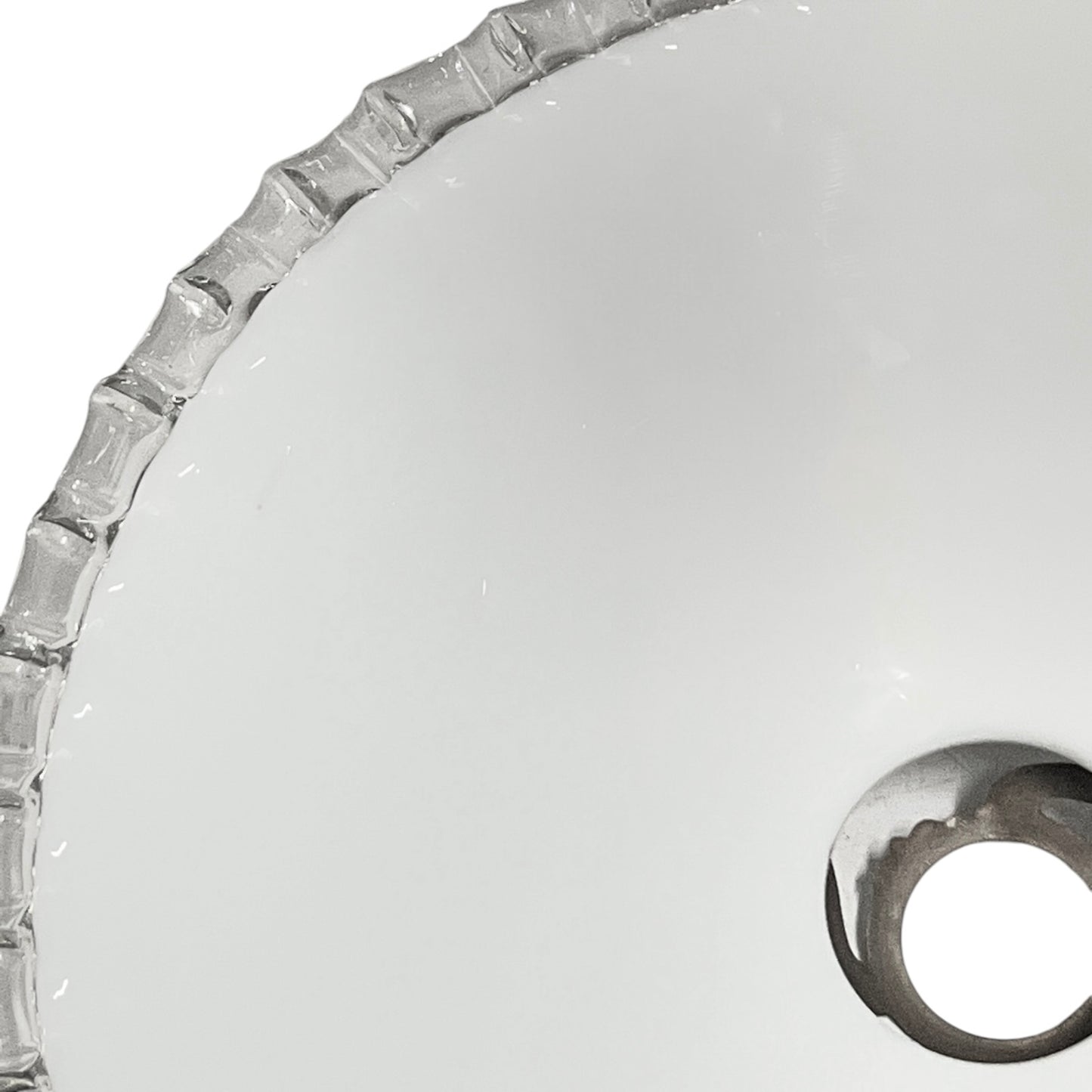 Close-up of a glass lampshade with a decorative edge on a white background