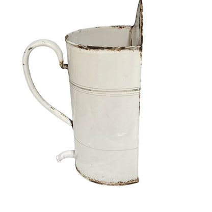 A distressed white enamel metal planter with a rustic, weathered finish showing brown rust-like detailing along the rim, base, and spout, set against a plain white background.