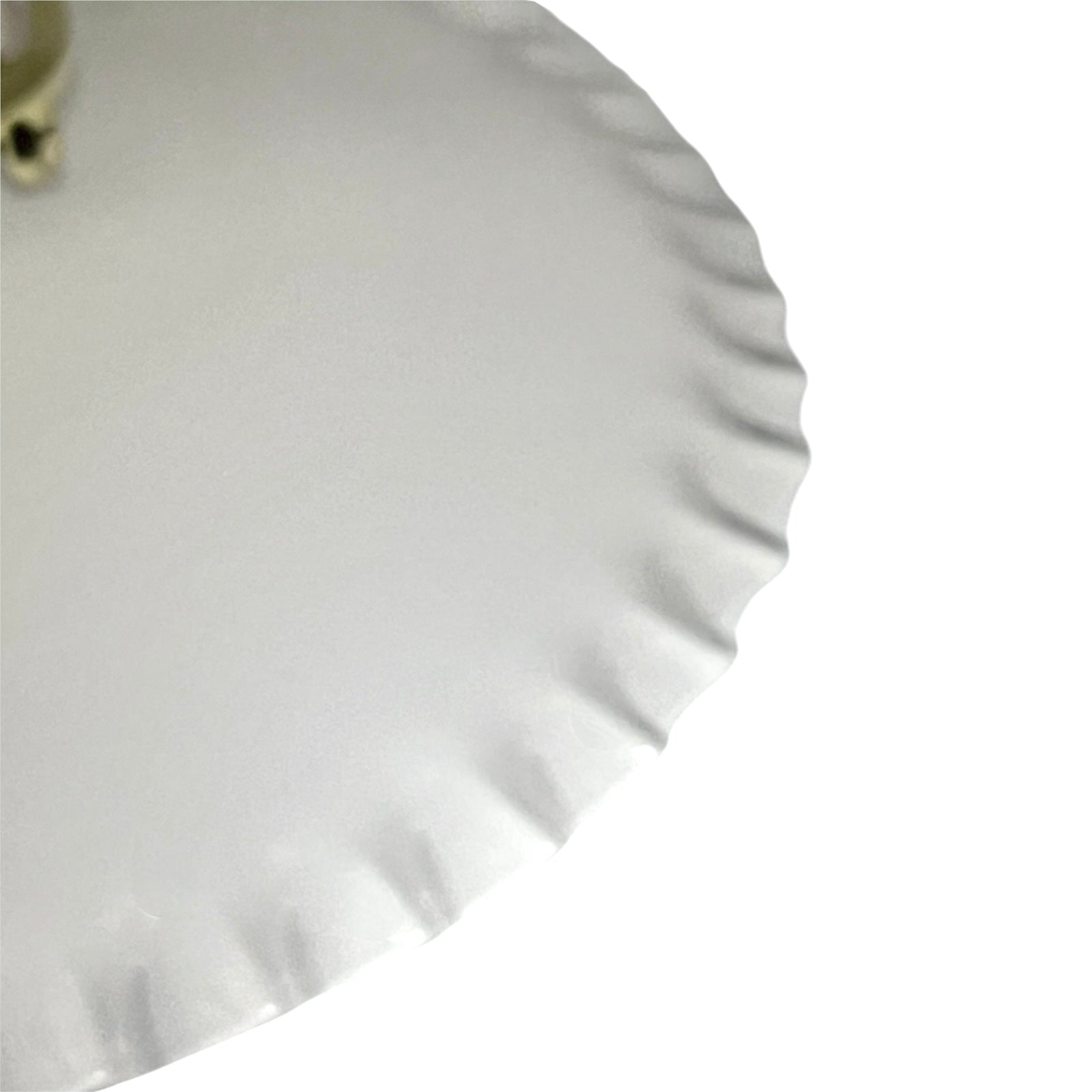 A close-up of a white glass lampshade with a scalloped or wavy rim, shown against a plain white background.