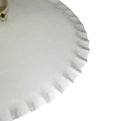 A close-up of a white glass lampshade with a scalloped or wavy rim, shown against a plain white background.