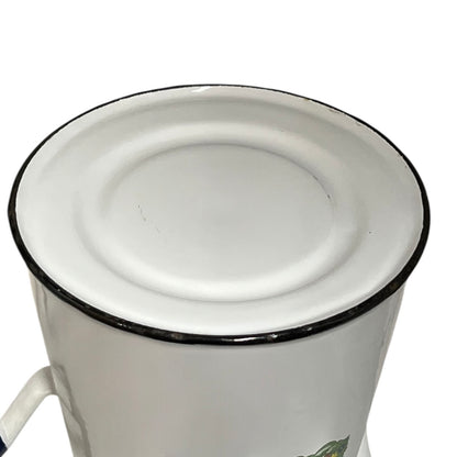 Close up of an enamel coffee pot on a white background