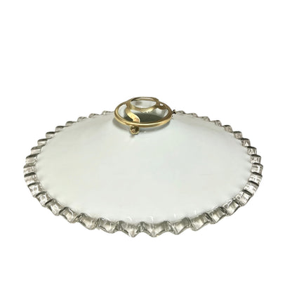 Vintage-style lampshade with scalloped edge on a white background