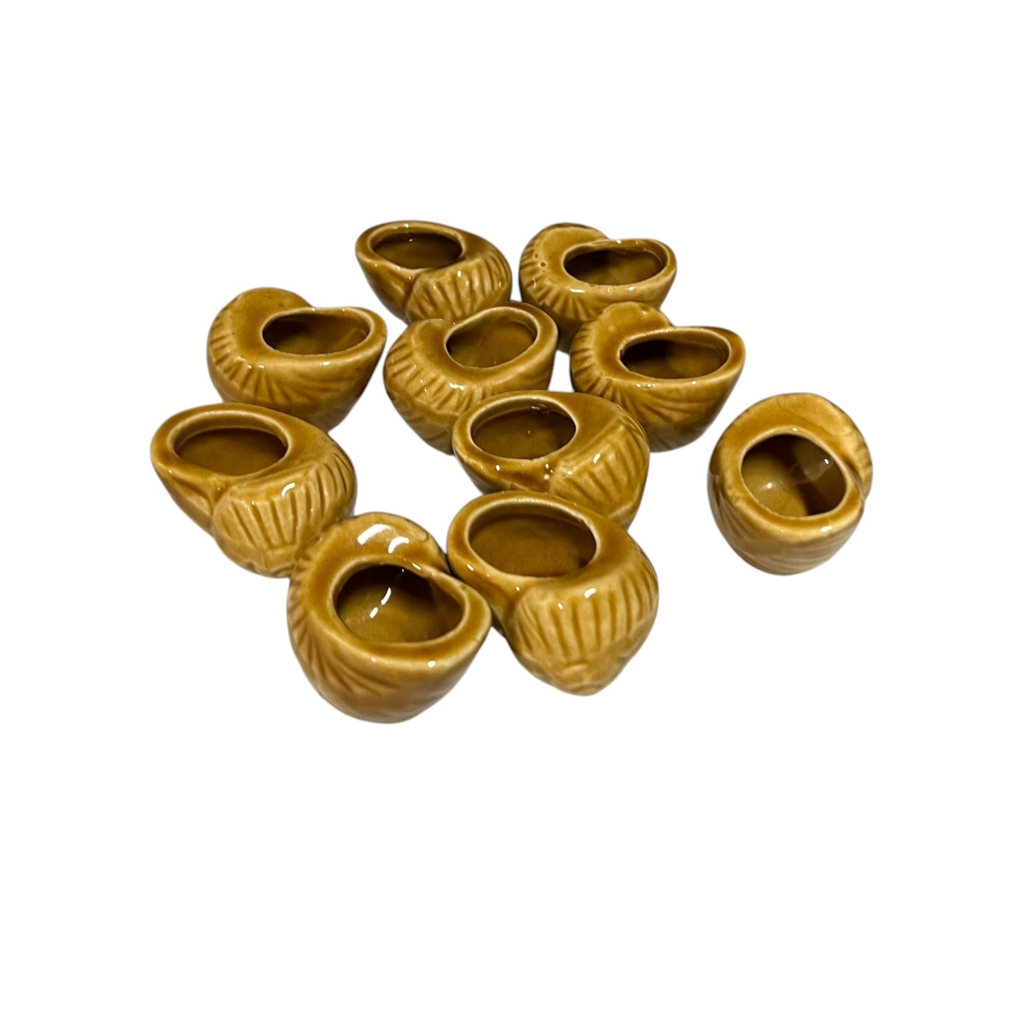 Set of ten small brown ceramic escargots snail pots on a white background