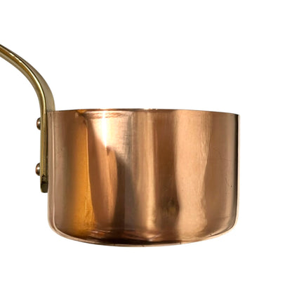 French copper ladle with a brass handle  on a white background
