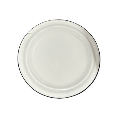 A round white enamel plate with a thin black rim, photographed from directly above on a white background.