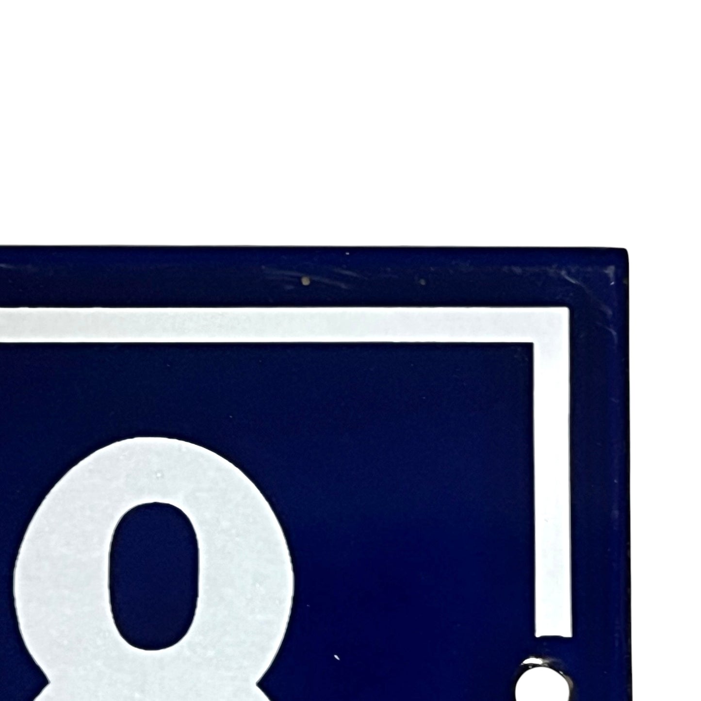 close up of a French vintage blue and white door number 88 on a white background 