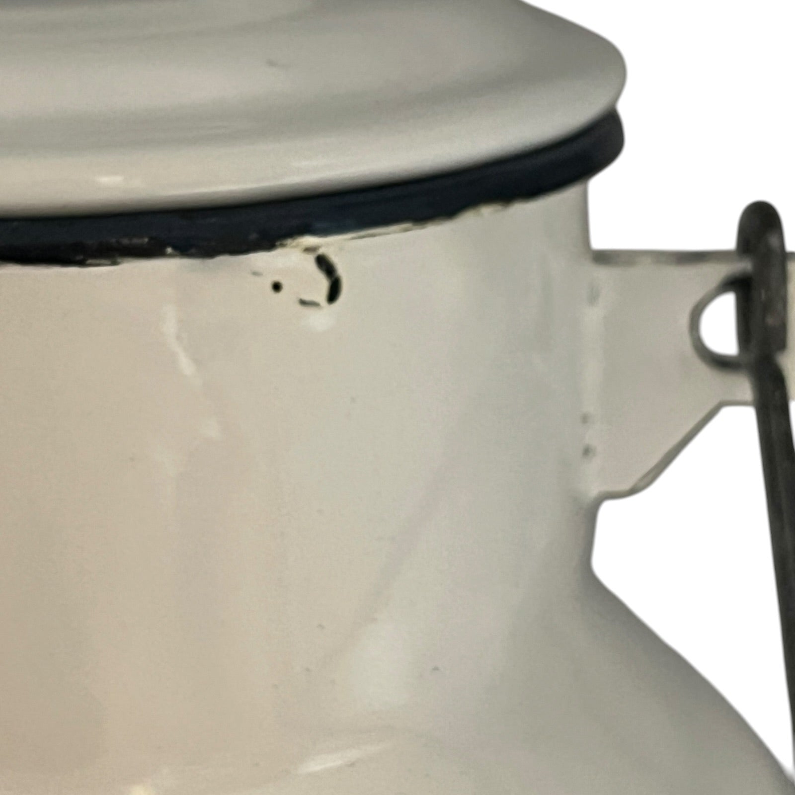 Close up of a white enamel milk churn and mug with duck design on a white background