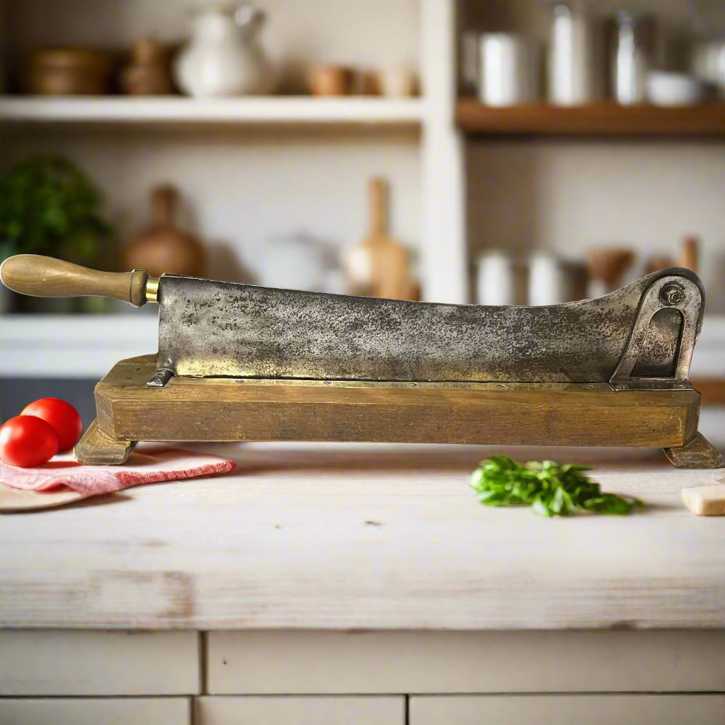 French Restaurant Size Baguette Cutter with a wooden base and a worn stainless steel slicer