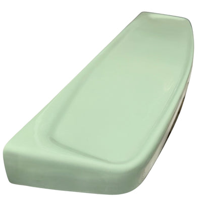 Pale green ceramic shelf on a white background