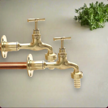 Pair of brass and copper wall mounted faucet taps ideal for kitchen or bathroom