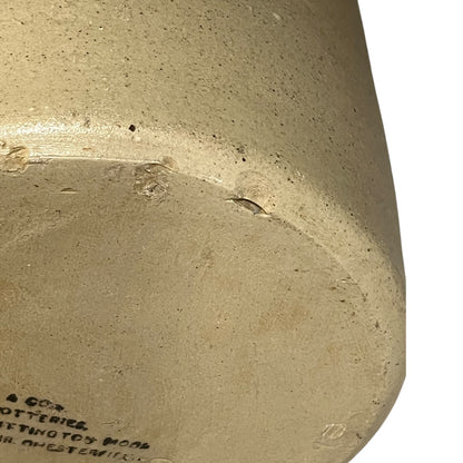 close up of a ww1 SRD jar base with a makers stamp on a white background 