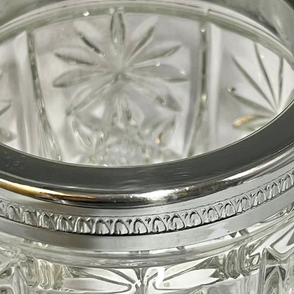 Close up of a decorative glass vintage ice bucket on a white background