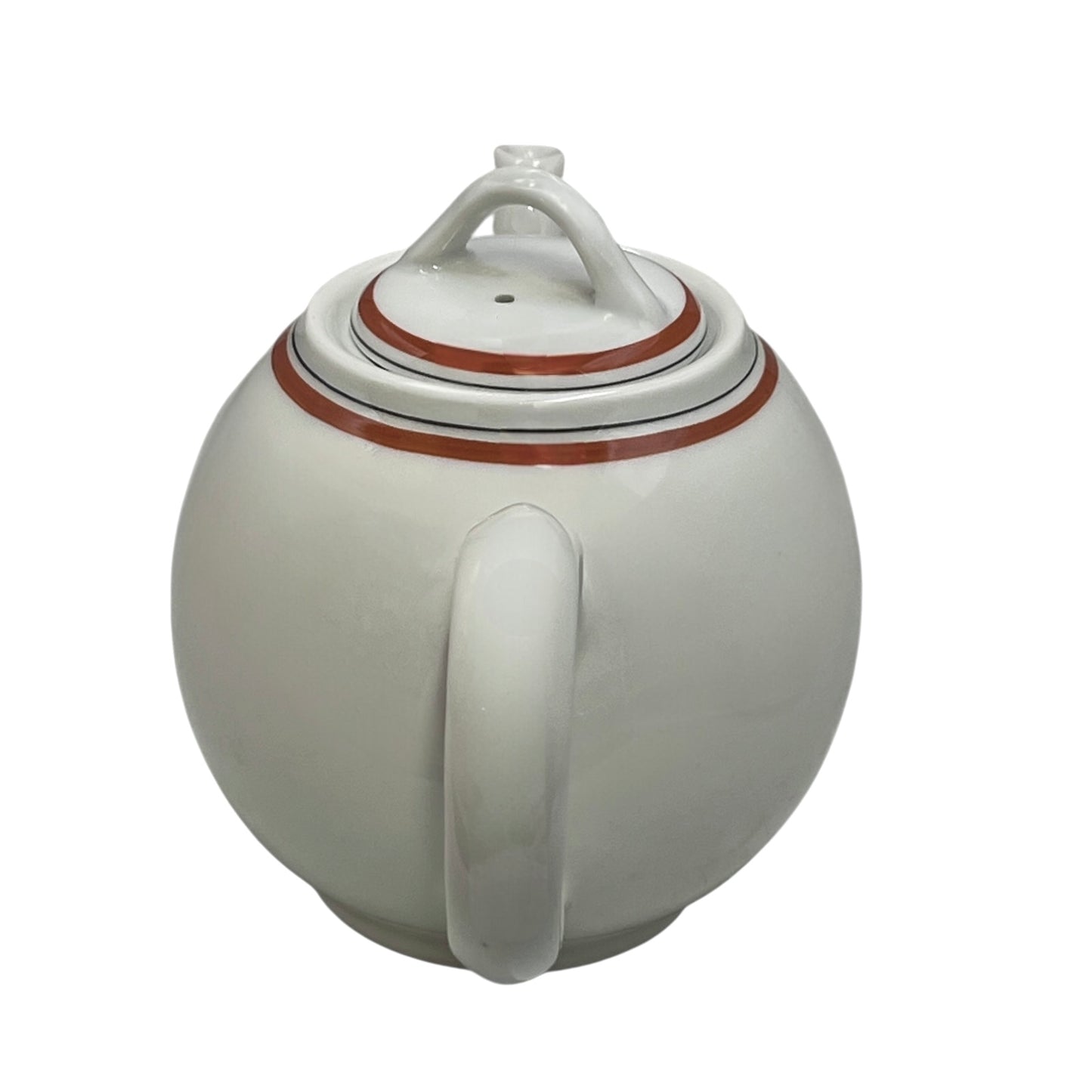 White ceramic teapot with orange red accents on a white background