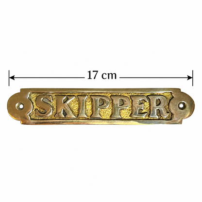 A brass Skipper door plaque with a black measure and text showing a size of 17cm displayed on a white background