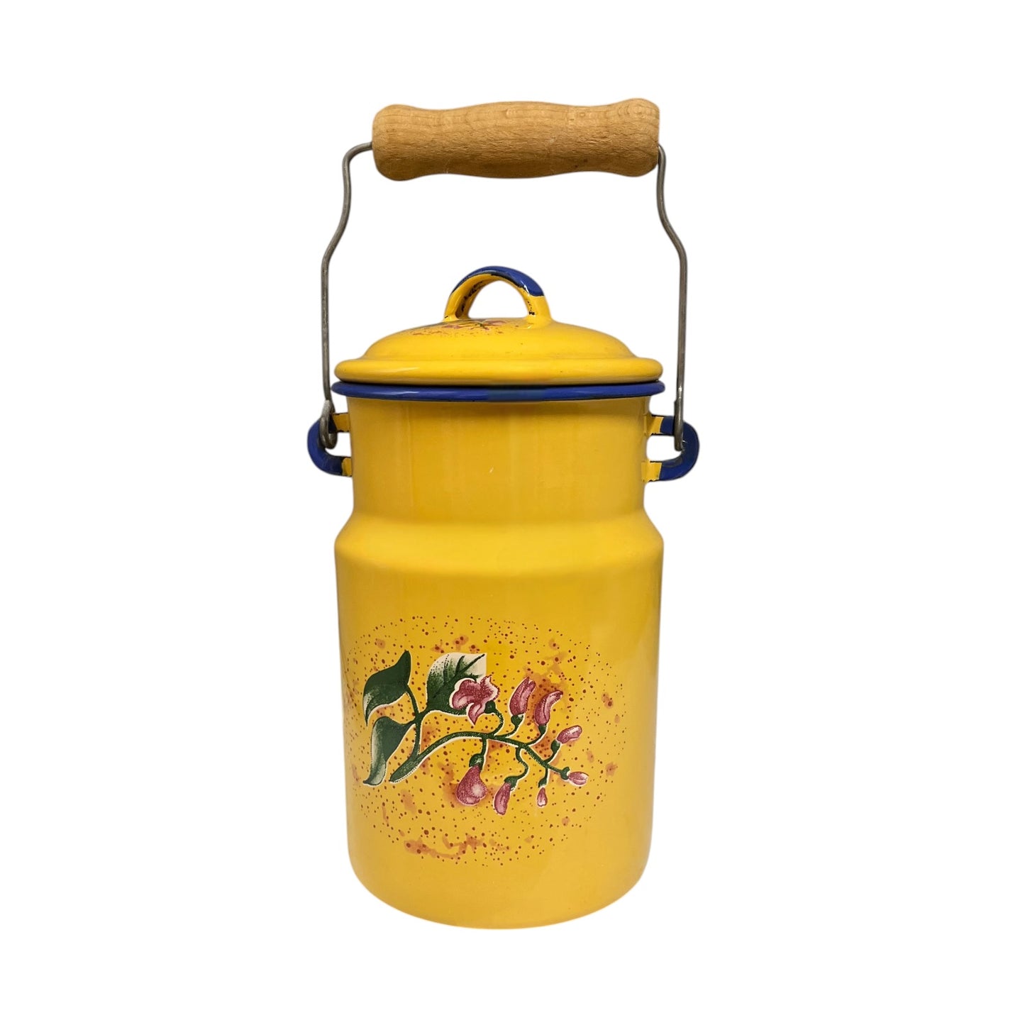 A vintage yellow enamel milk canister with a wooden handle, metal wire frame, blue trim, and a floral print on the front, isolated on a white background.