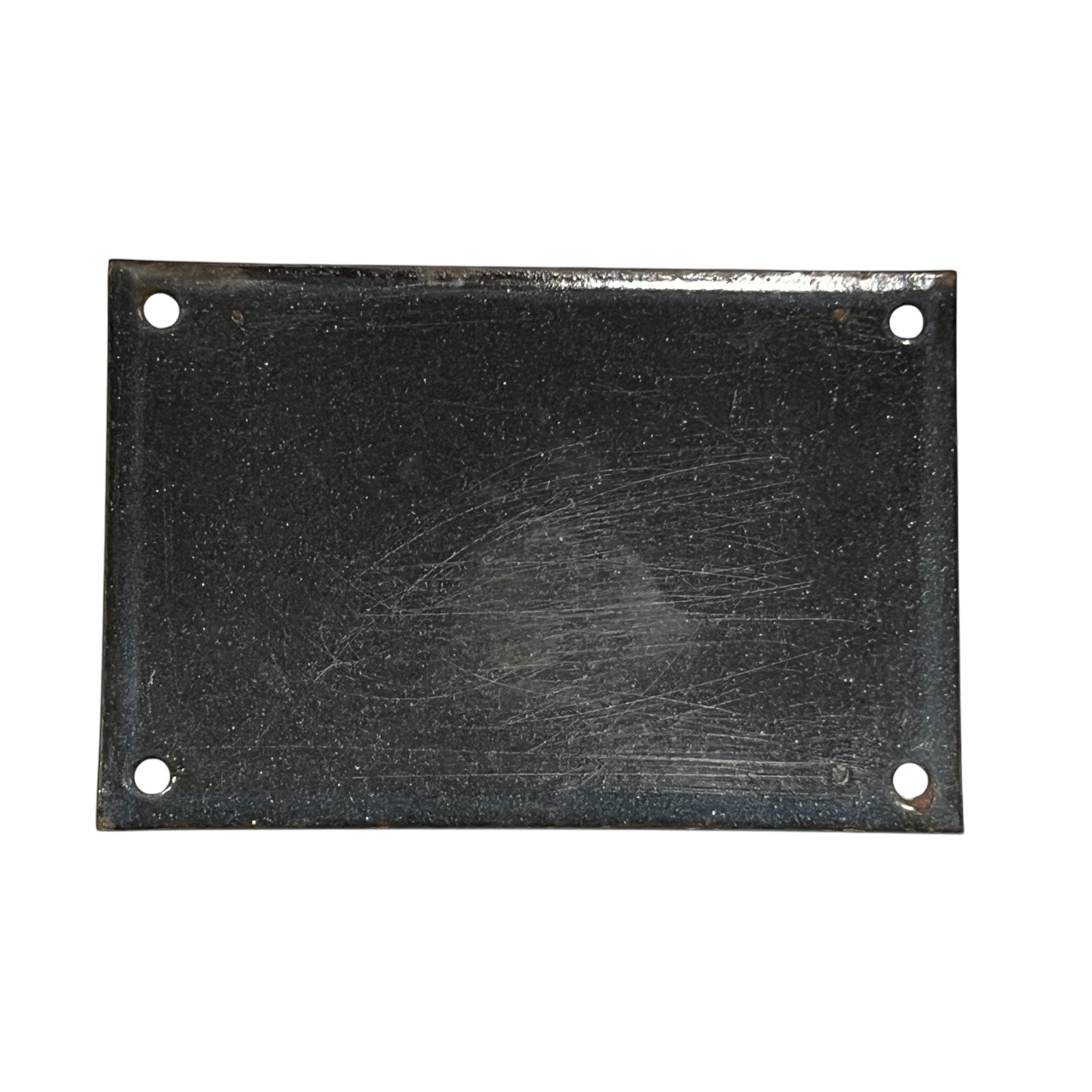 Rectangular black metal plate with holes on a white background