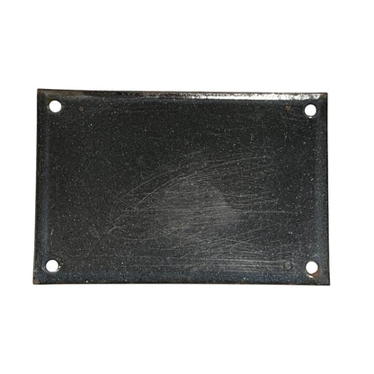 Rectangular black metal plate with holes on a white background