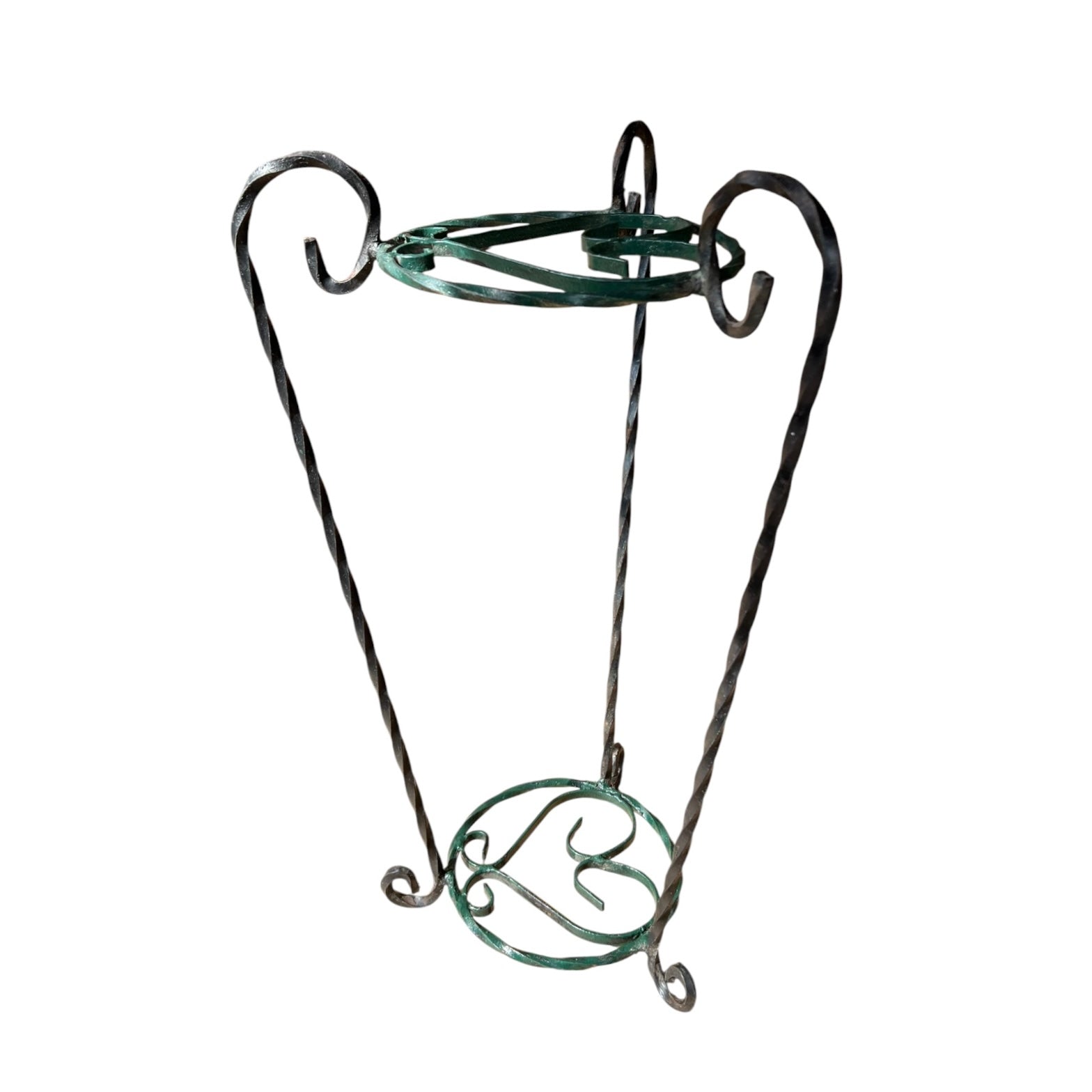 Green and black wrought iron jardinière scrolled plant stand on a white background