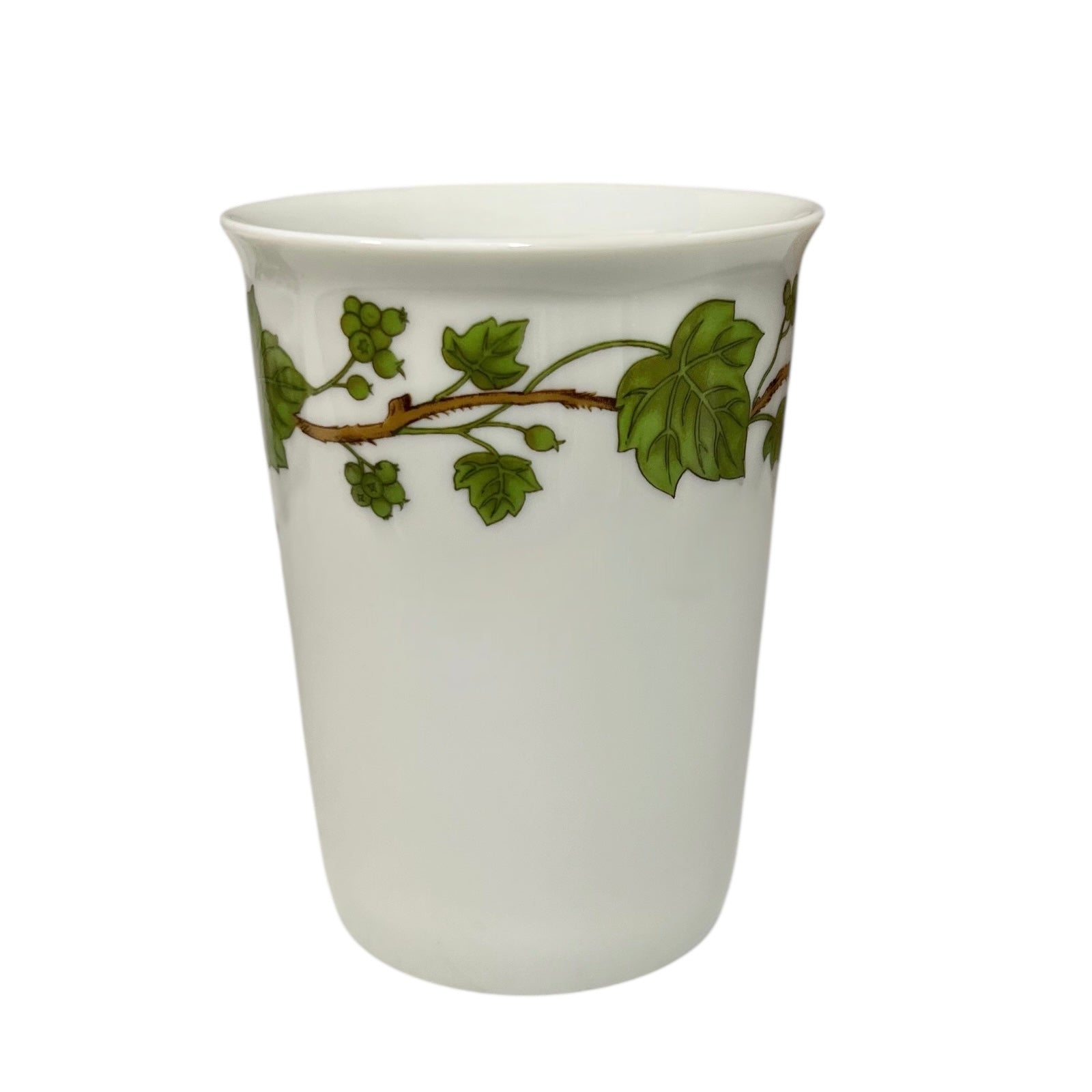 Porcelain bathroom tumbler  featuring green leaf patterns on a white background