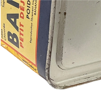 Corner of a vintage box with 'Petit Dej' branding on a white background