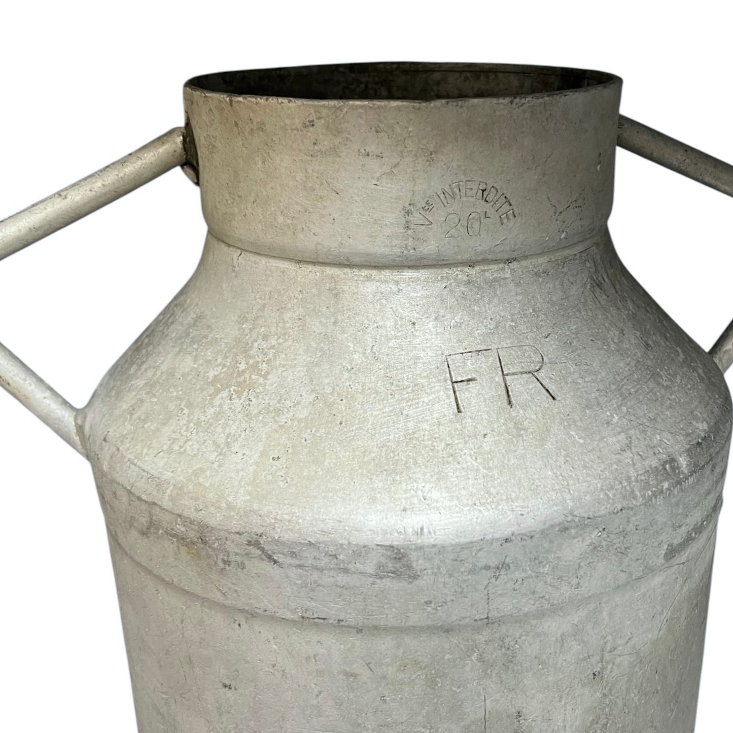 Close up of a vintage metal milk churn on a white background