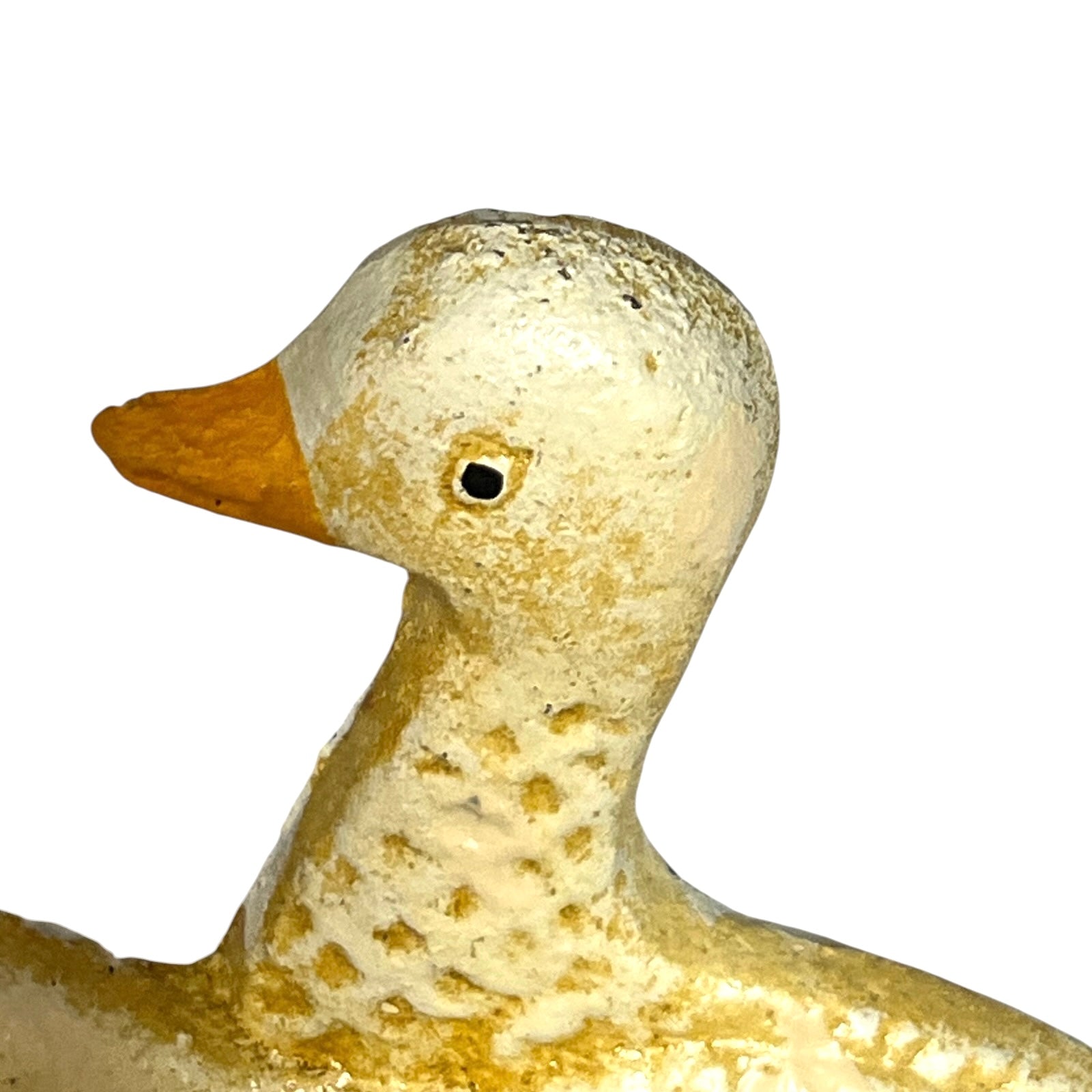 A close-up of a decorative duck figurine with a textured, distressed finish in cream and gold tones, featuring a small orange beak and a black eye, set against a plain white background.