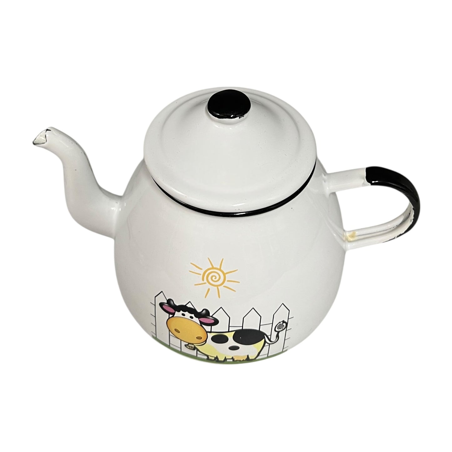 White teapot with cow design on a white background