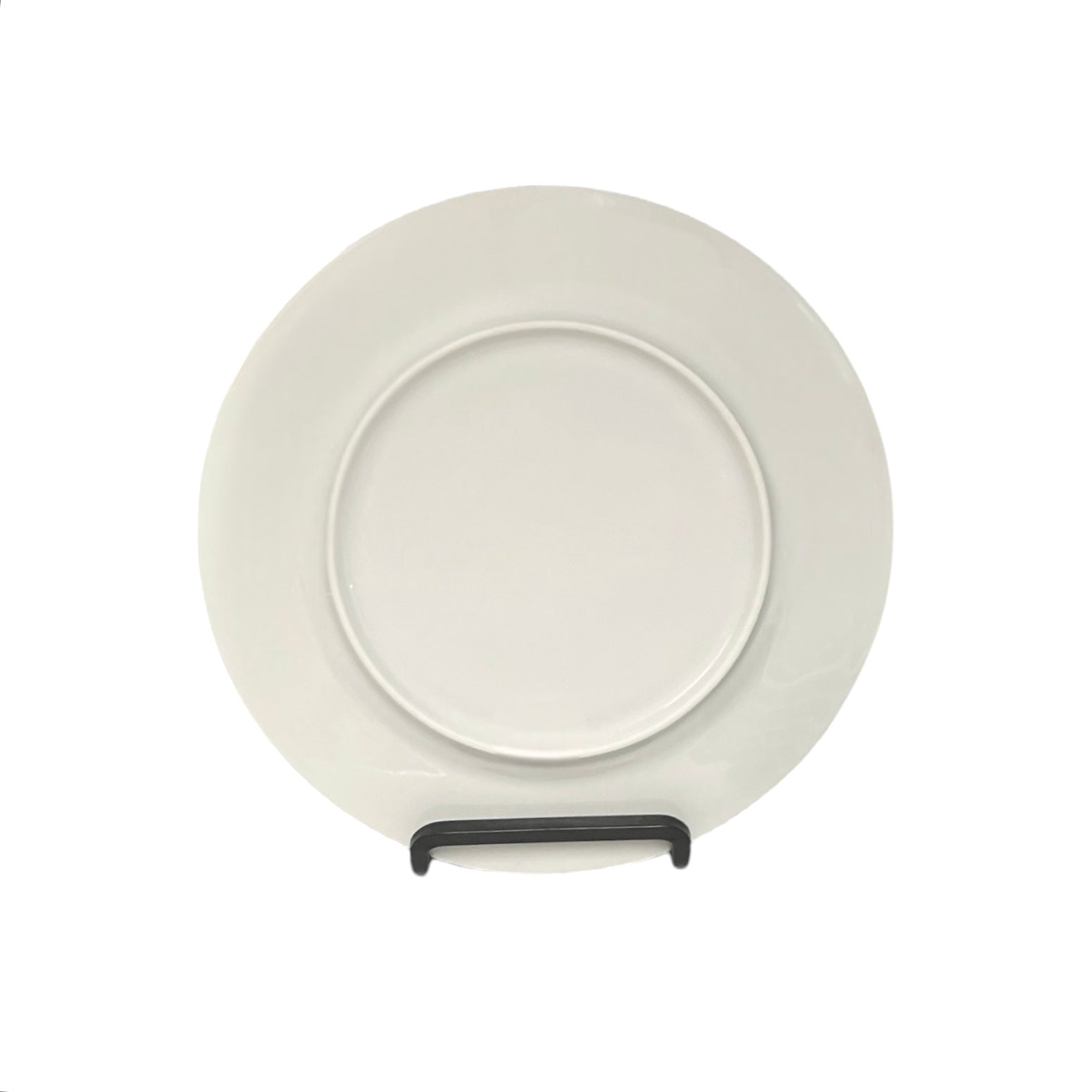 White plate with a black handle on a white background