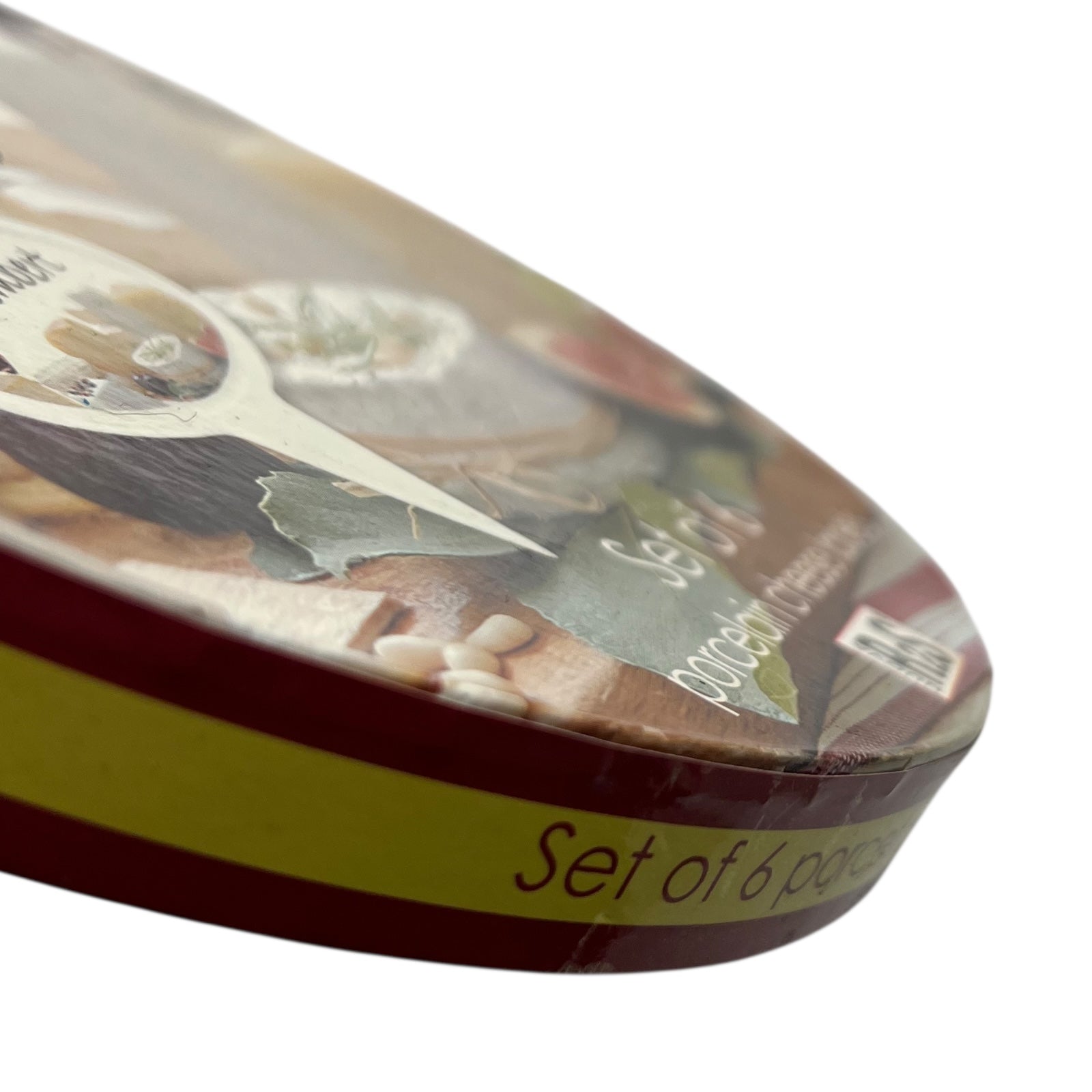 Close up of a porcelain cheese label in a red box on a white background