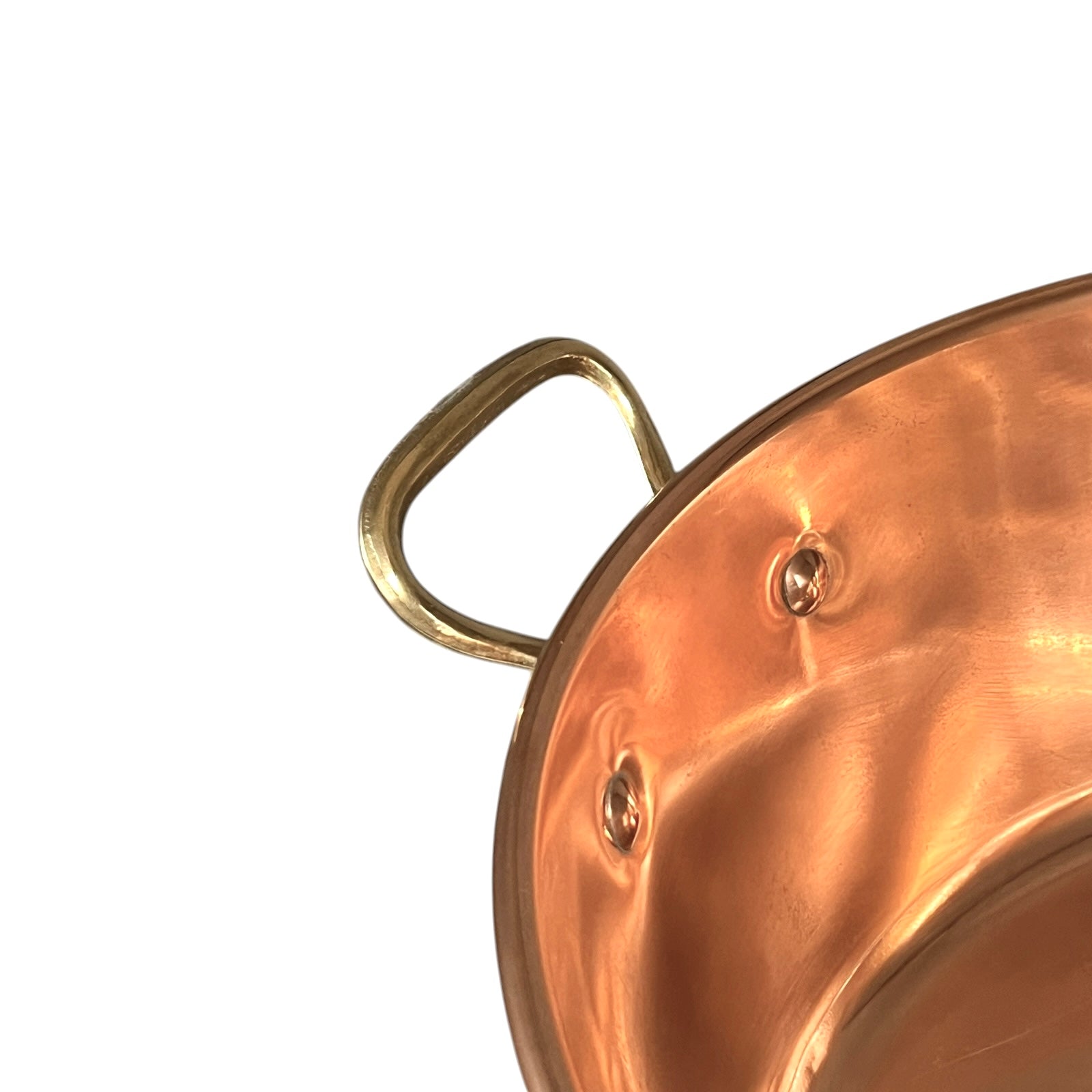 Close-up of a copper sink with a drain plug on a white background