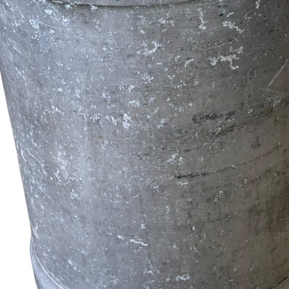 Close-up of a grey milk churn on a white background