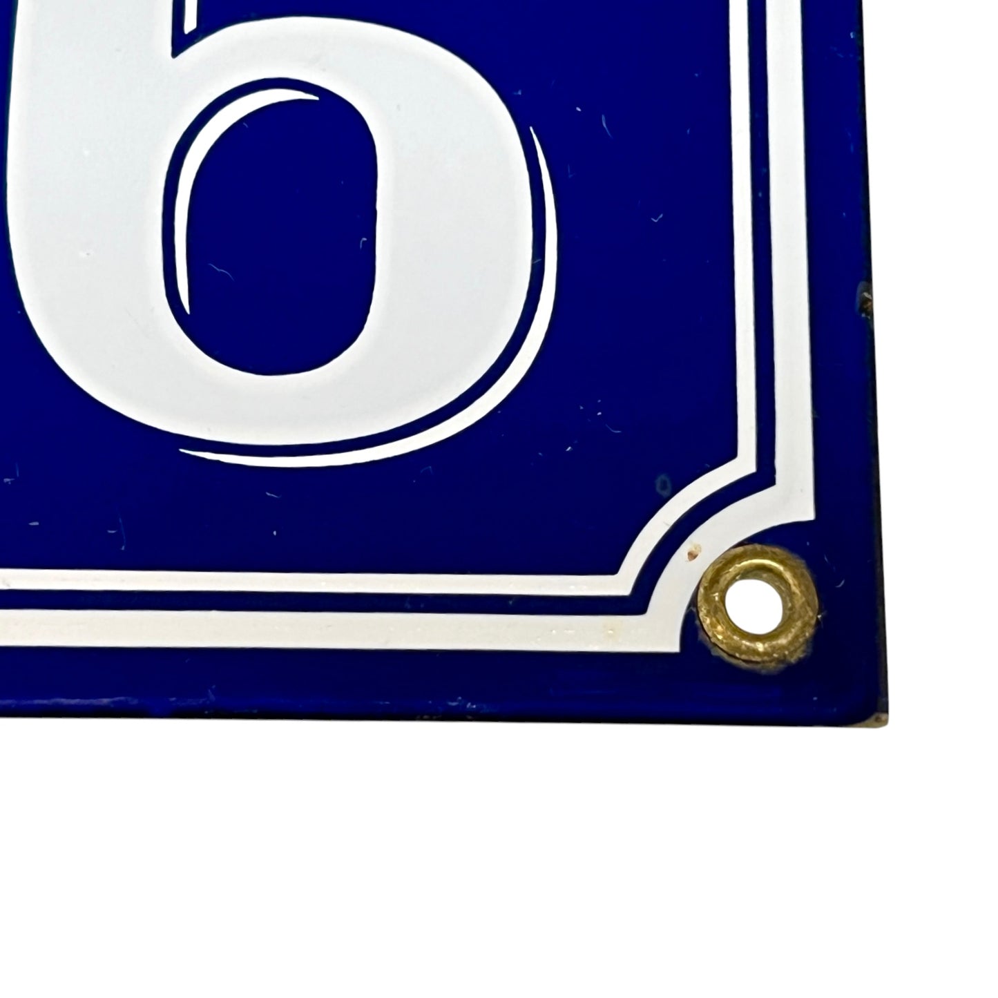 Blue and white sign with the number '6' on a white background
