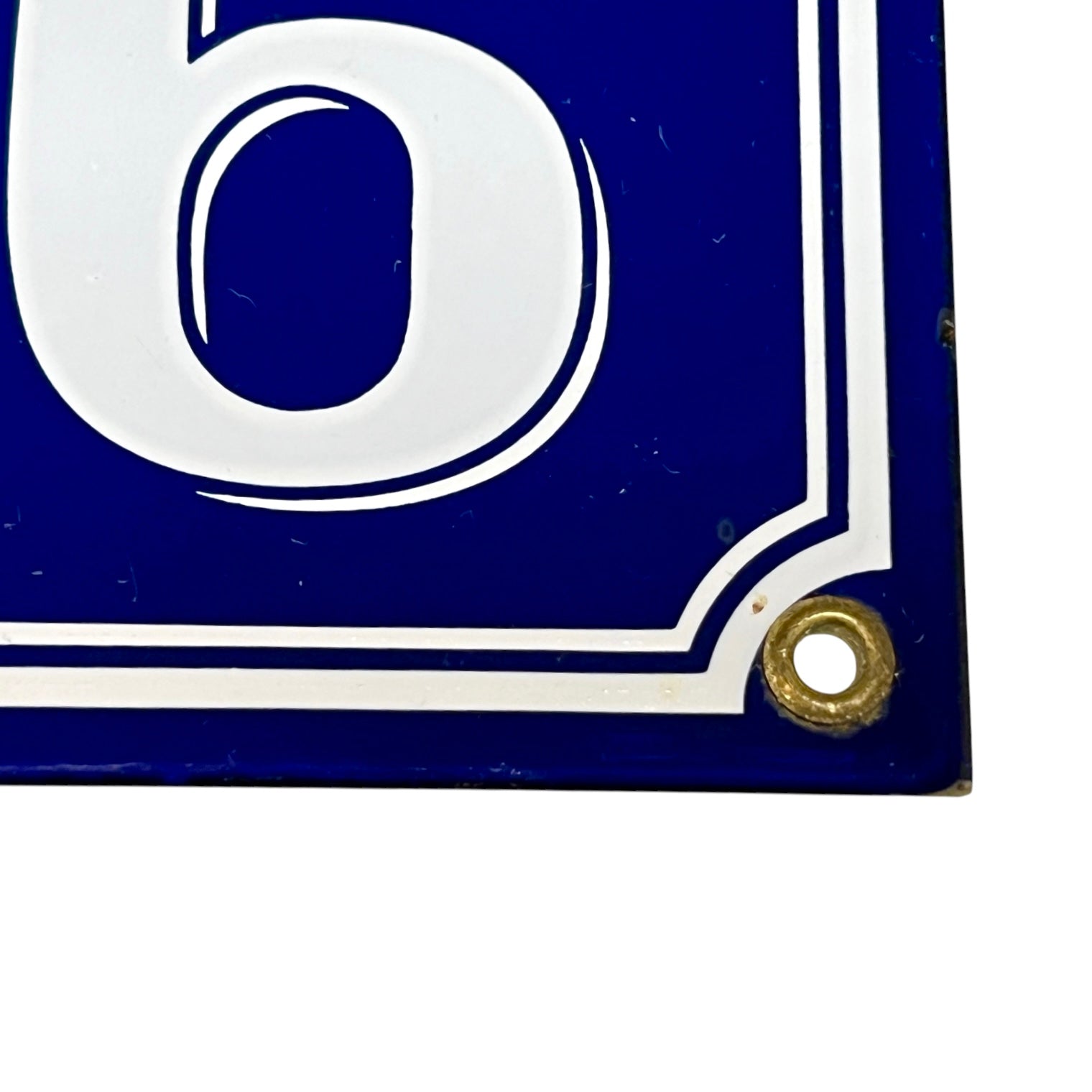 Blue and white sign with the number '6' on a white background